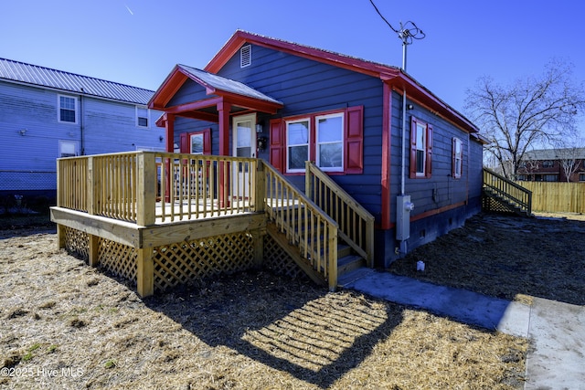 view of front of home featuring a wooden deck