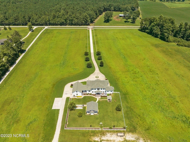 birds eye view of property with a rural view