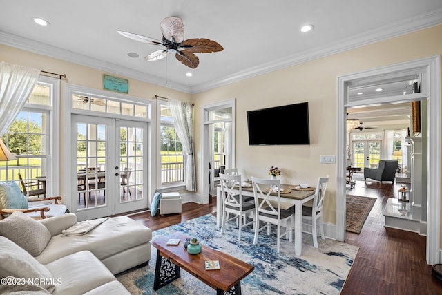 living room with french doors, ceiling fan, crown molding, and dark wood-type flooring