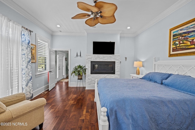 bedroom featuring crown molding, dark wood-type flooring, and ceiling fan