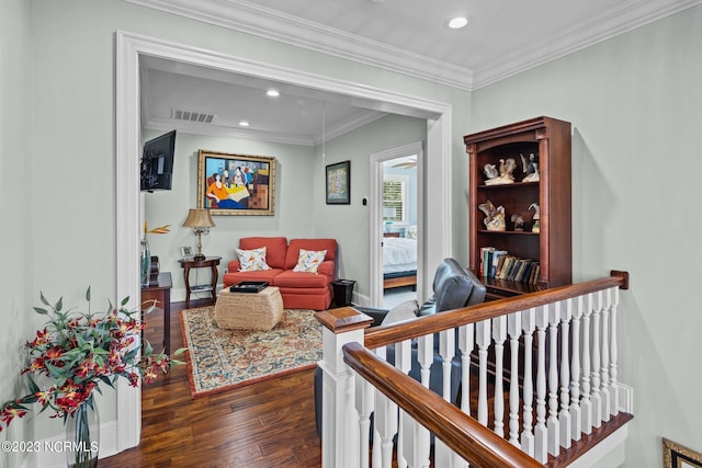 interior space featuring ornamental molding and dark hardwood / wood-style floors