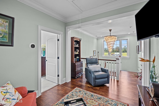 living area with ornamental molding and dark hardwood / wood-style floors