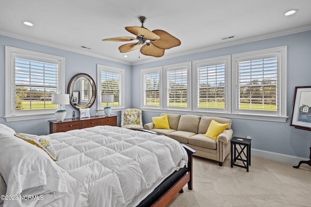 bedroom with ceiling fan, ornamental molding, and light carpet