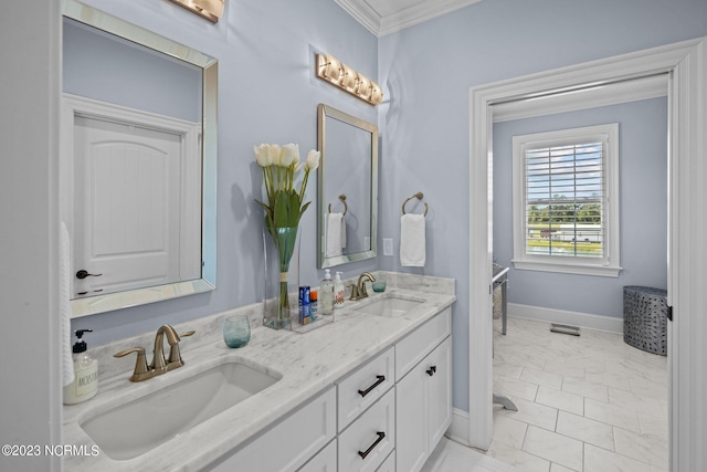 bathroom with ornamental molding and vanity