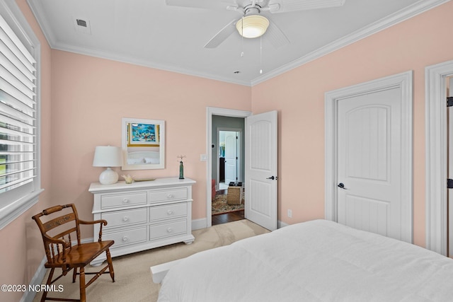 bedroom featuring ornamental molding, light carpet, and ceiling fan