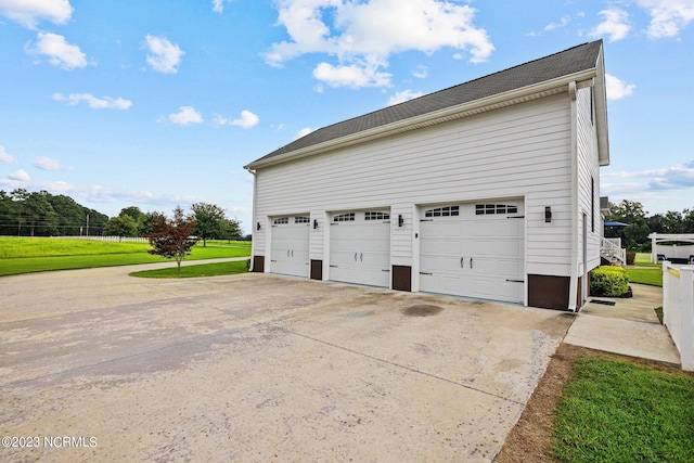 garage with a yard