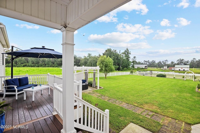 view of yard with an outdoor living space, a pergola, and a deck