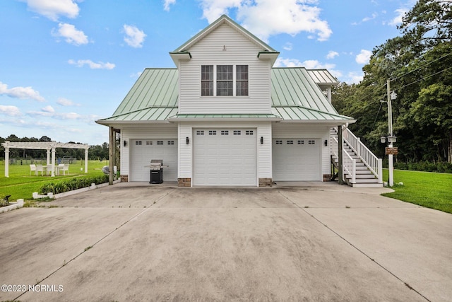 exterior space with a garage and a front lawn