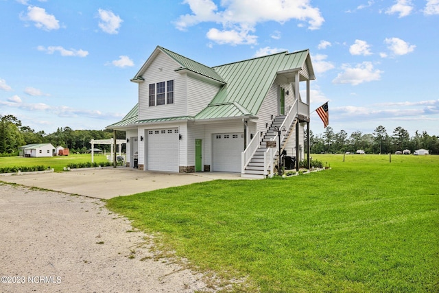 view of property with a garage and a front lawn