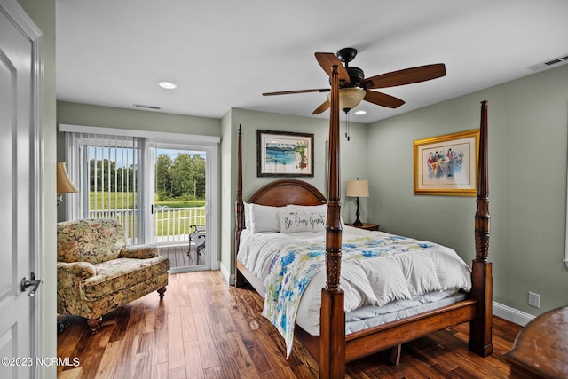 bedroom with wood-type flooring, access to outside, and ceiling fan