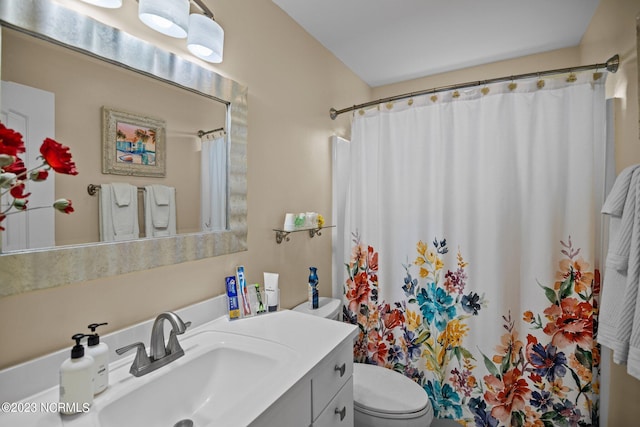 bathroom with vanity, a shower with curtain, and toilet