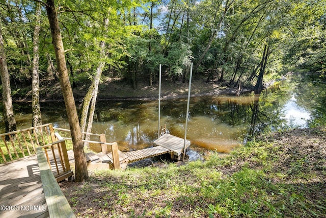 view of dock with a water view