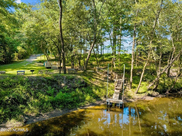 surrounding community featuring a water view