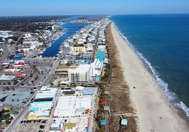 bird's eye view featuring a water view and a view of the beach