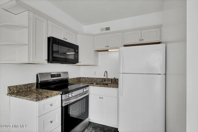 kitchen featuring sink, dark stone countertops, electric range, white refrigerator, and white cabinets