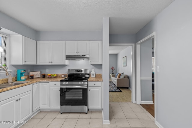 kitchen with electric stove, white cabinetry, light tile patterned flooring, and sink