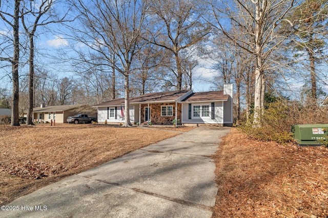 single story home featuring a carport