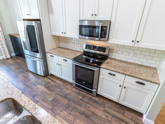 214 Admiral Ct, Sneads Ferry, NC 28460 - kitchen with appliances with stainless steel finishes, dark wood-type flooring, and white cabinetry