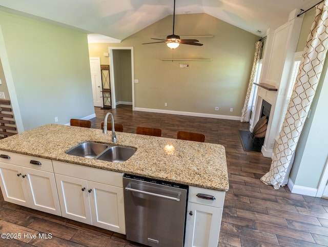 214 Admiral Ct, Sneads Ferry, NC 28460 - kitchen featuring stainless steel dishwasher, dark wood-style flooring, white cabinets, ceiling fan, and lofted ceiling