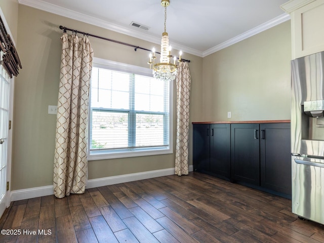 214 Admiral Ct, Sneads Ferry, NC 28460 - unfurnished dining area with a chandelier, ornamental molding, and dark wood finished floors