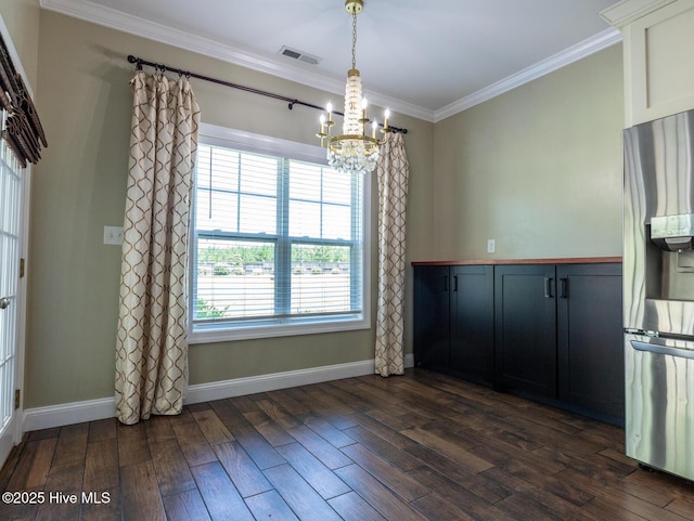 214 Admiral Ct, Sneads Ferry, NC 28460 - unfurnished dining area featuring a chandelier, crown molding, and dark wood finished floors