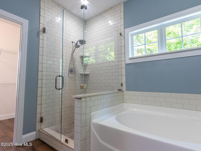 214 Admiral Ct, Sneads Ferry, NC 28460 - full bathroom featuring a stall shower, a bath, and a walk in closet