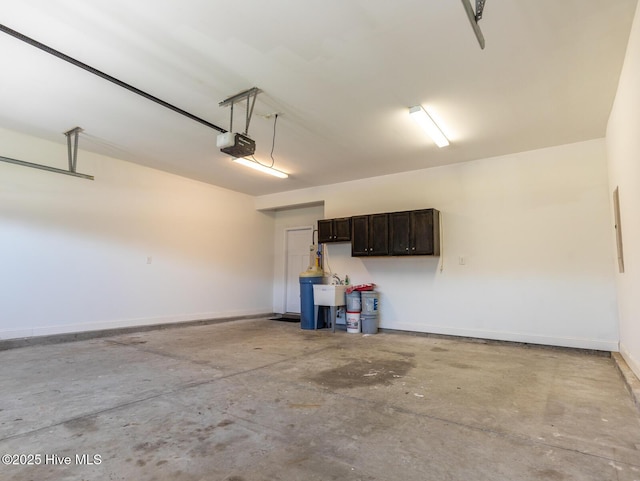 214 Admiral Ct, Sneads Ferry, NC 28460 - garage with a garage door opener and baseboards