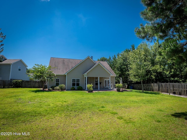 214 Admiral Ct, Sneads Ferry, NC 28460 - rear view of house with a fenced backyard and a patio