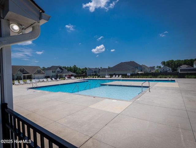 214 Admiral Ct, Sneads Ferry, NC 28460 - community pool with a patio area and a residential view