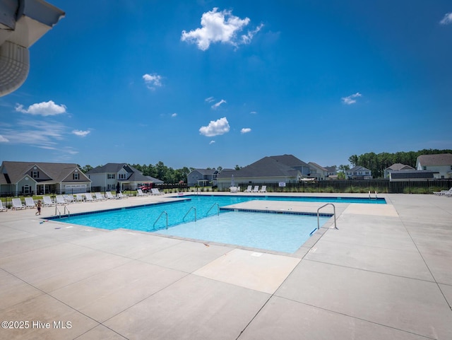 214 Admiral Ct, Sneads Ferry, NC 28460 - community pool with a patio area and a residential view