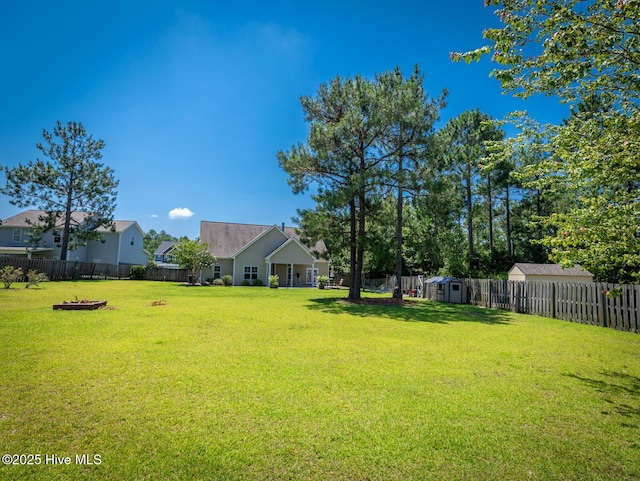 214 Admiral Ct, Sneads Ferry, NC 28460 - fenced backyard featuring a storage unit