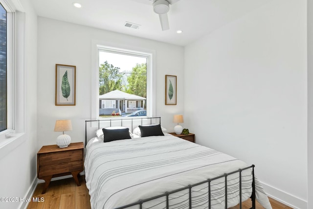 bedroom featuring hardwood / wood-style flooring and ceiling fan