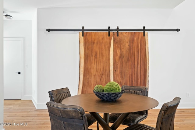 dining space featuring light wood-type flooring