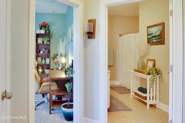 corridor featuring light tile patterned flooring