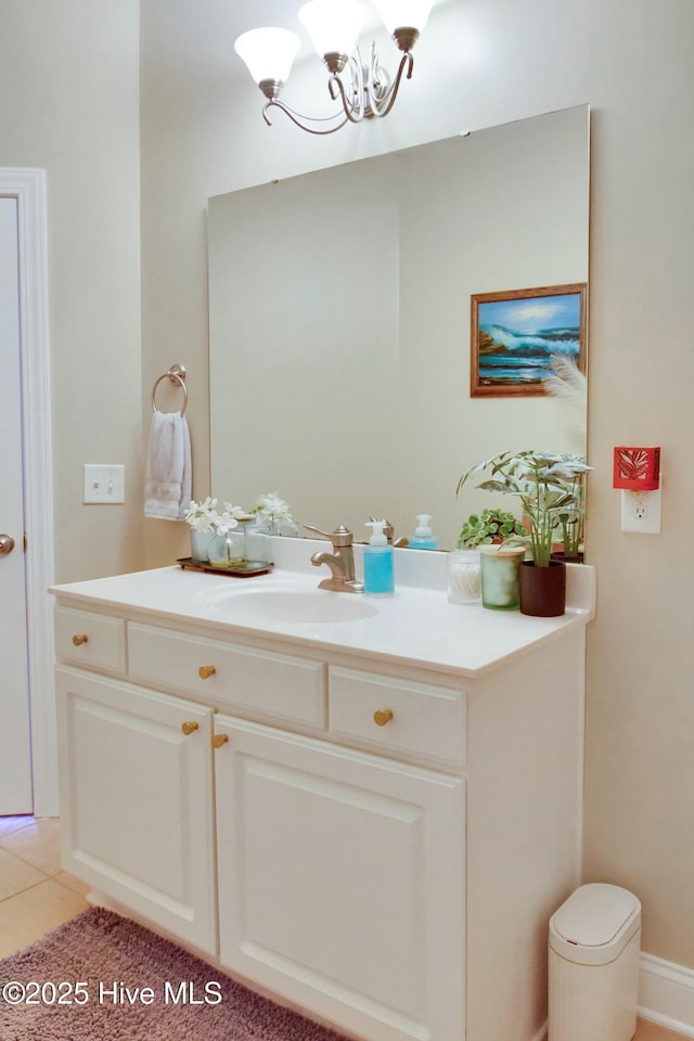 bathroom featuring vanity, a notable chandelier, and tile patterned floors