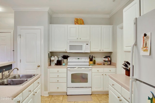 kitchen with sink, white appliances, and white cabinets