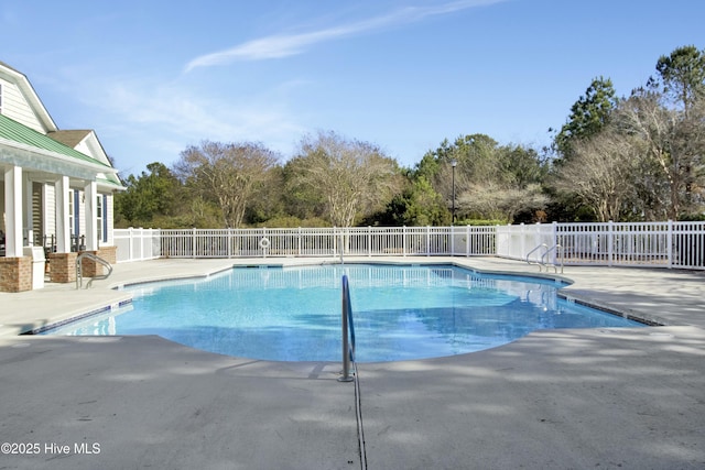 view of swimming pool with a patio area