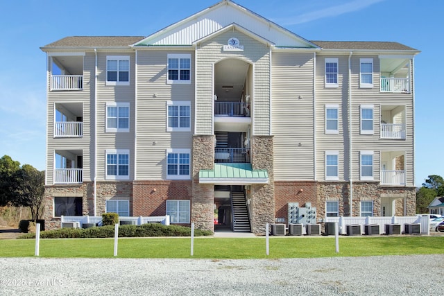 view of building exterior with central AC unit