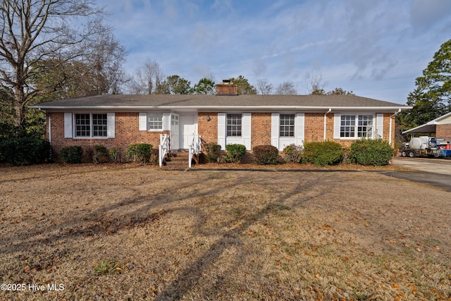 ranch-style house with a front yard