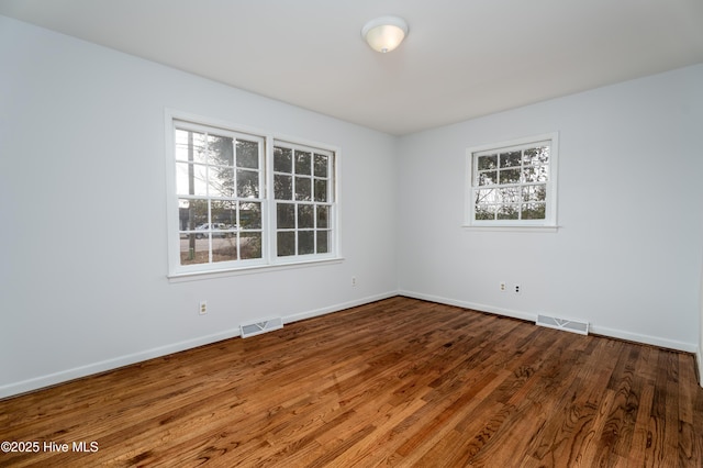 empty room featuring wood-type flooring