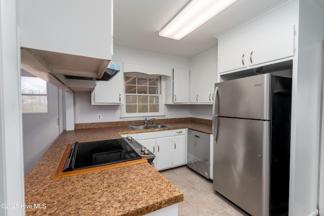 kitchen with white cabinetry, stainless steel appliances, crown molding, and sink