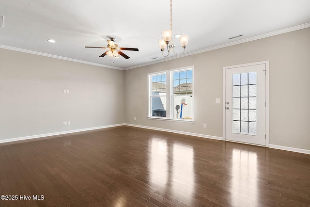 empty room with ornamental molding, dark hardwood / wood-style flooring, and ceiling fan with notable chandelier