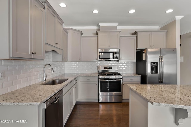 kitchen featuring light stone counters, appliances with stainless steel finishes, gray cabinets, and sink