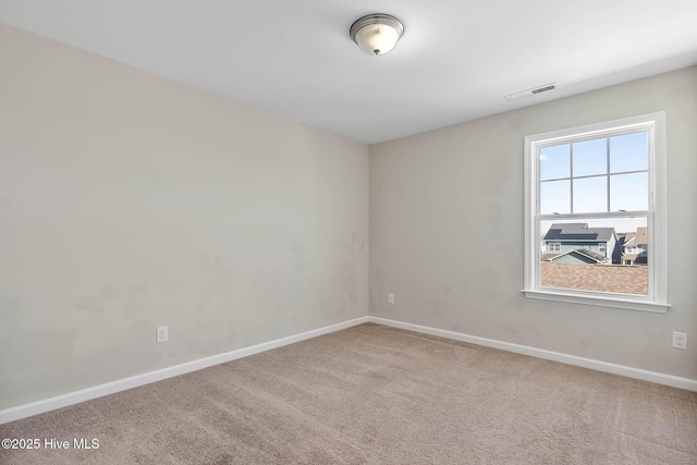 unfurnished room featuring carpet floors