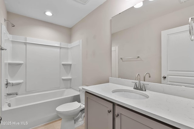 full bathroom with vanity, shower / bathtub combination, and toilet