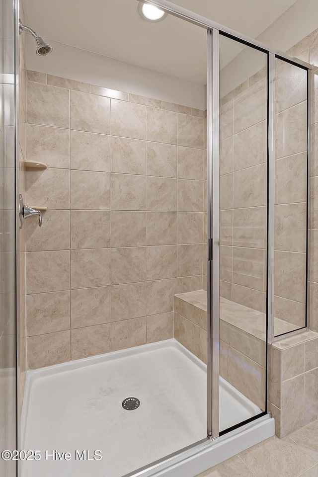 bathroom featuring an enclosed shower