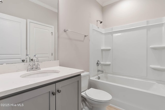 full bathroom with crown molding, bathtub / shower combination, vanity, and toilet