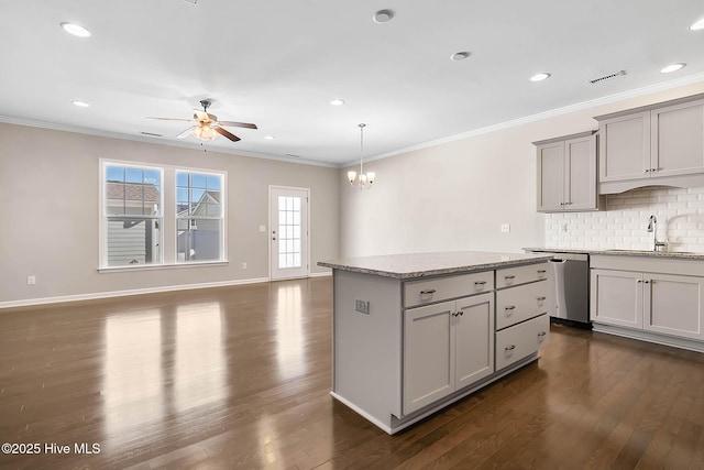 kitchen with dishwasher, sink, hanging light fixtures, and gray cabinetry