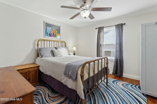 bedroom with ceiling fan, ornamental molding, and dark hardwood / wood-style flooring