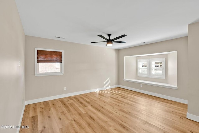 empty room featuring light hardwood / wood-style floors and ceiling fan